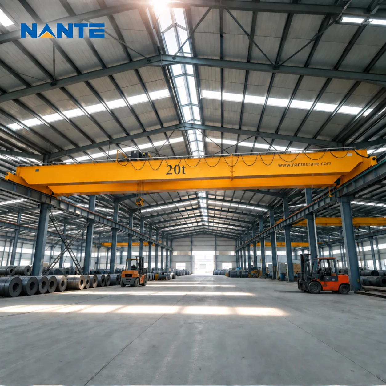 Double-girder overhead crane spanning a large industrial workshop
