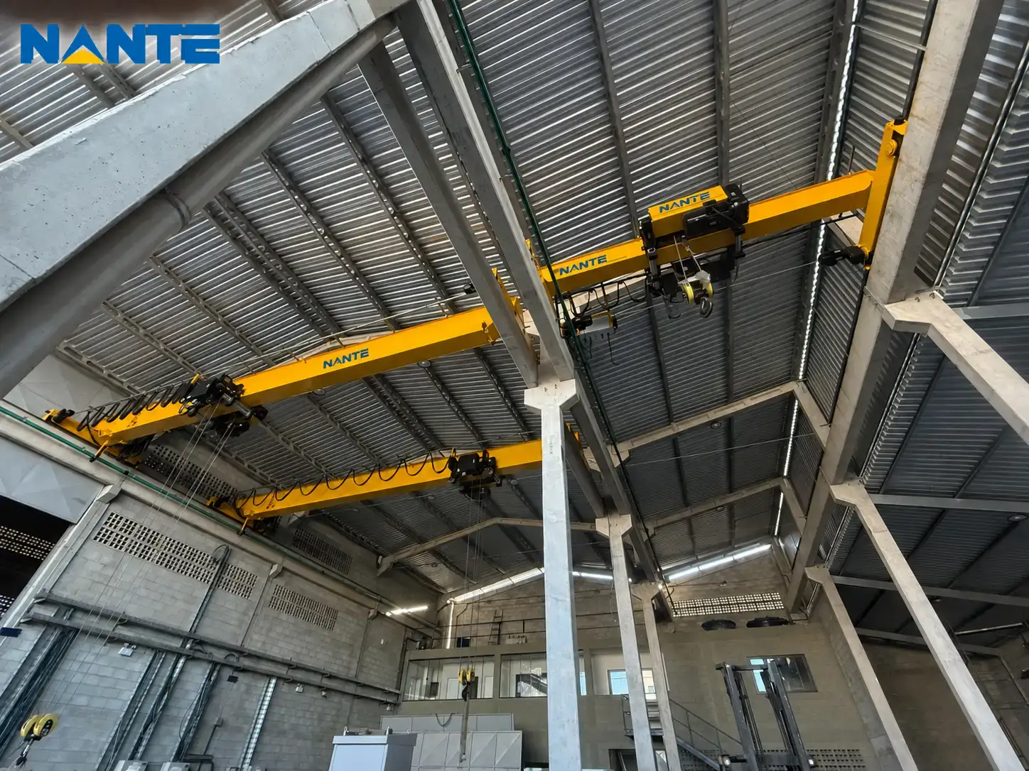 Industrial overhead cranes installed inside a factory building