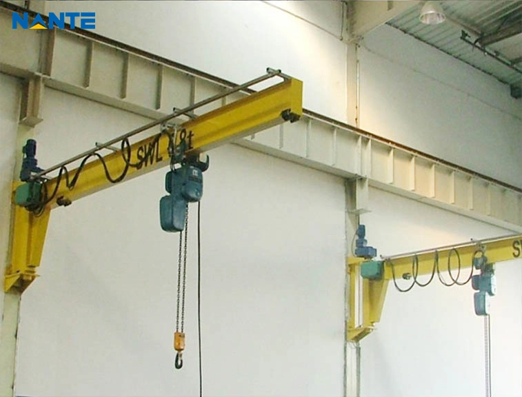 Wall-mounted jib crane with an electric hoist