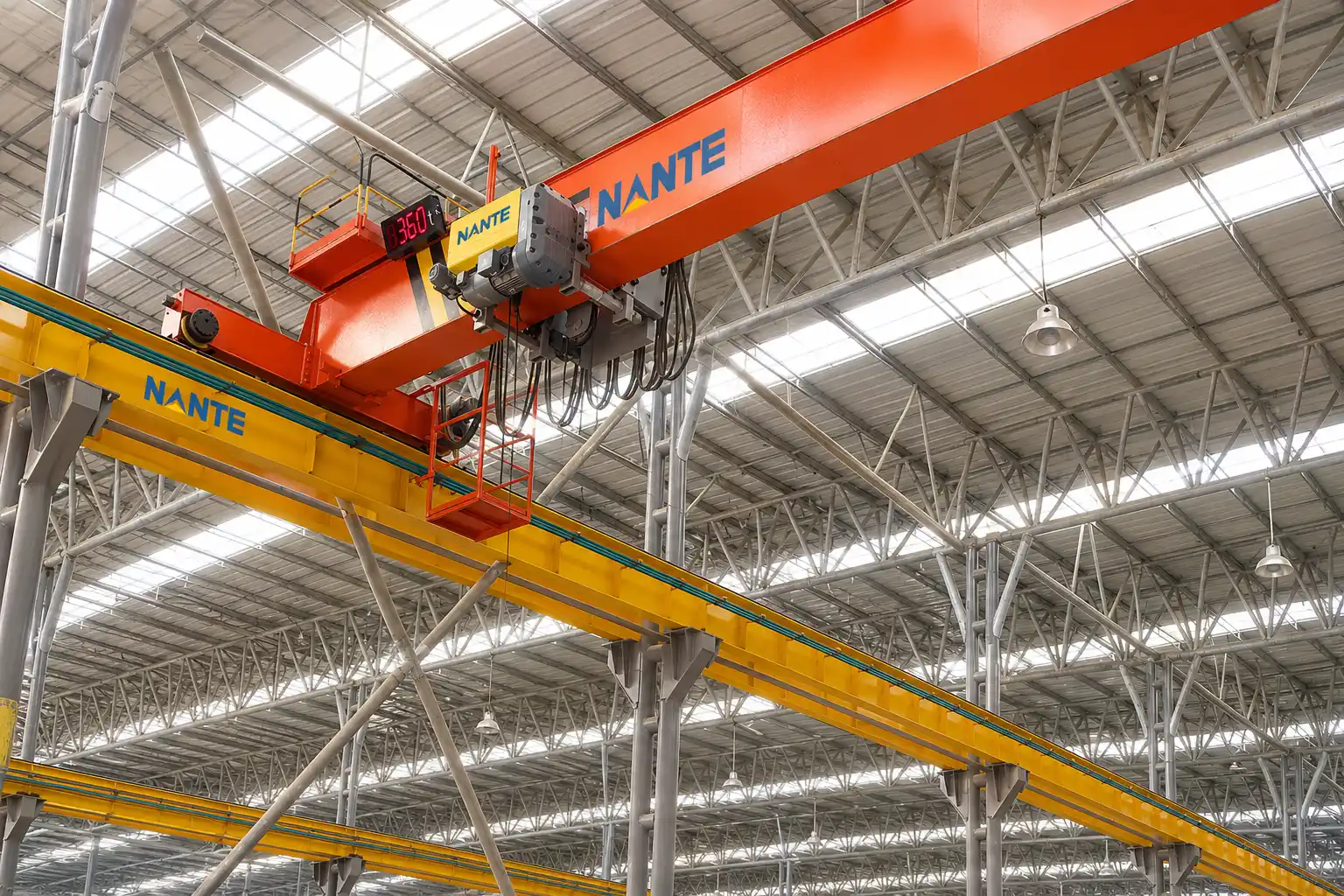 overhead bridge crane with hoist trolley and lifting motor in an industrial factory