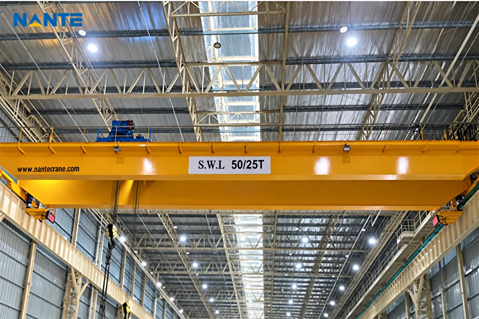 Overhead crane with 50 ton and 25 ton lifting capacities in an industrial workshop